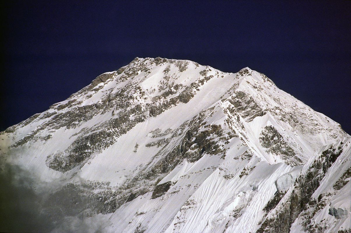 408 Dhaulagiri South Face Close Up Early Morning From Lete What's the south face like? inquired Ichac. ... Lachenal: monstrous slope, several miles high, and without a break, something like the north face of the Matterhorn, which as you know isn't exactly an attractive place, only this is three times as big. Herzog: The best thing is just to write off the south face (Maurice Herzog, Annapurna). Here is a close up of the Dhaulagiri South face in the early morning sun from Lete.